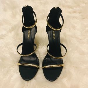Black and gold bebe Heel sandals